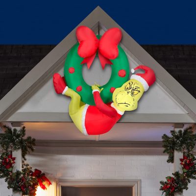 Gemmy Inflatable Grinch Hanging from Wreath Dr. Seuss
